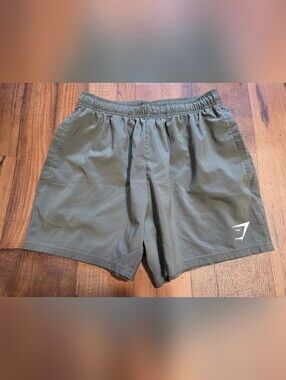 Gymshark Women's Olive Green Athletic Shorts Eith Pockets. Sz S